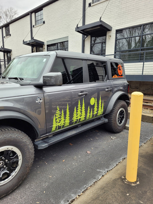 Trees Forest Side Graphic Vinyl Decal Sticker for your Car, Truck, RV, Camper, Window or Trailer available in multiple colors and sizes.